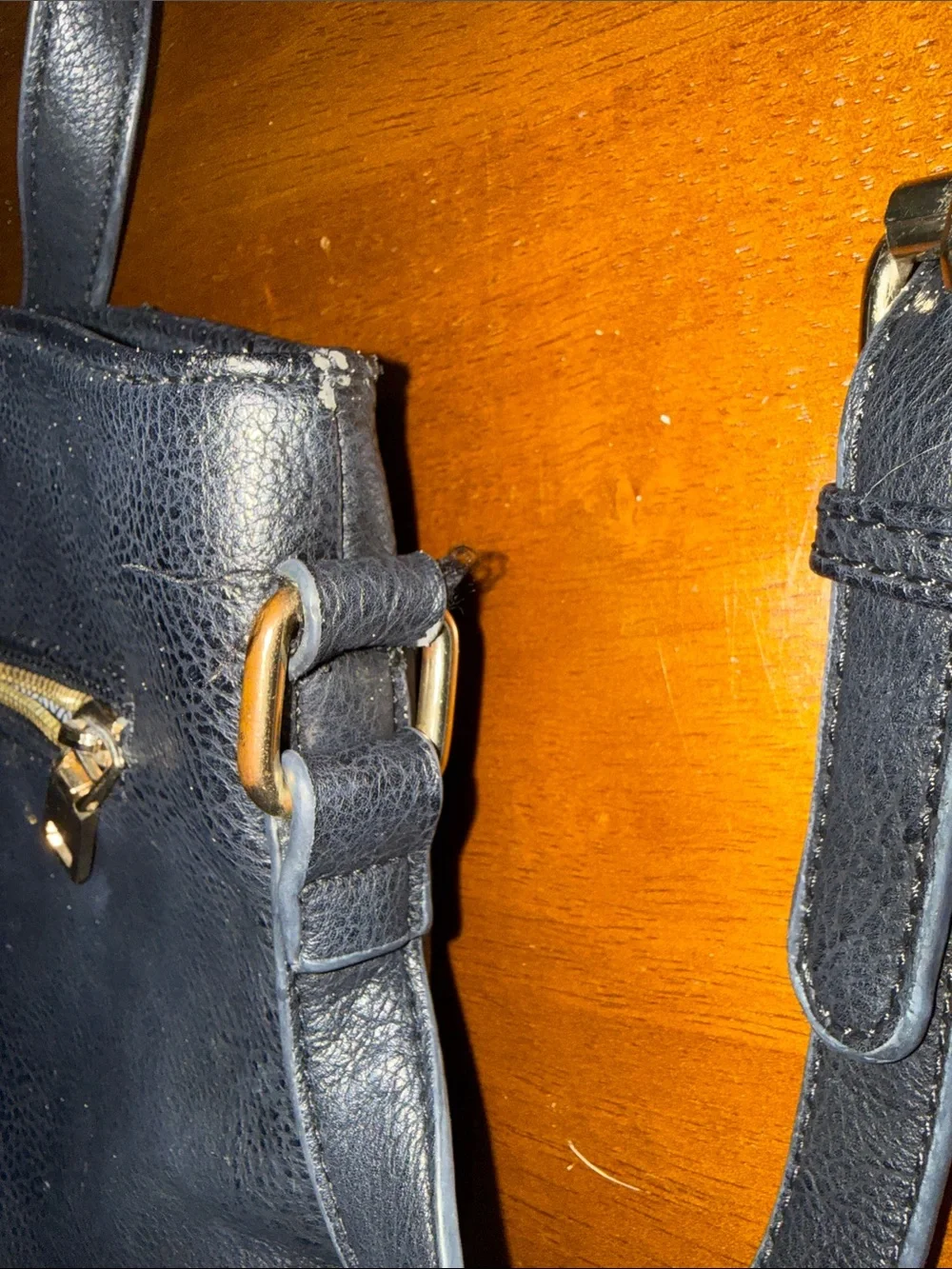 Classic Black Leather Crossbody Bag with Gold Zippers